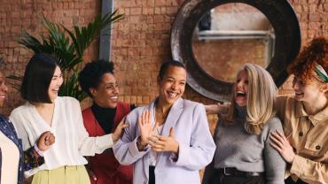 Business women laughing together