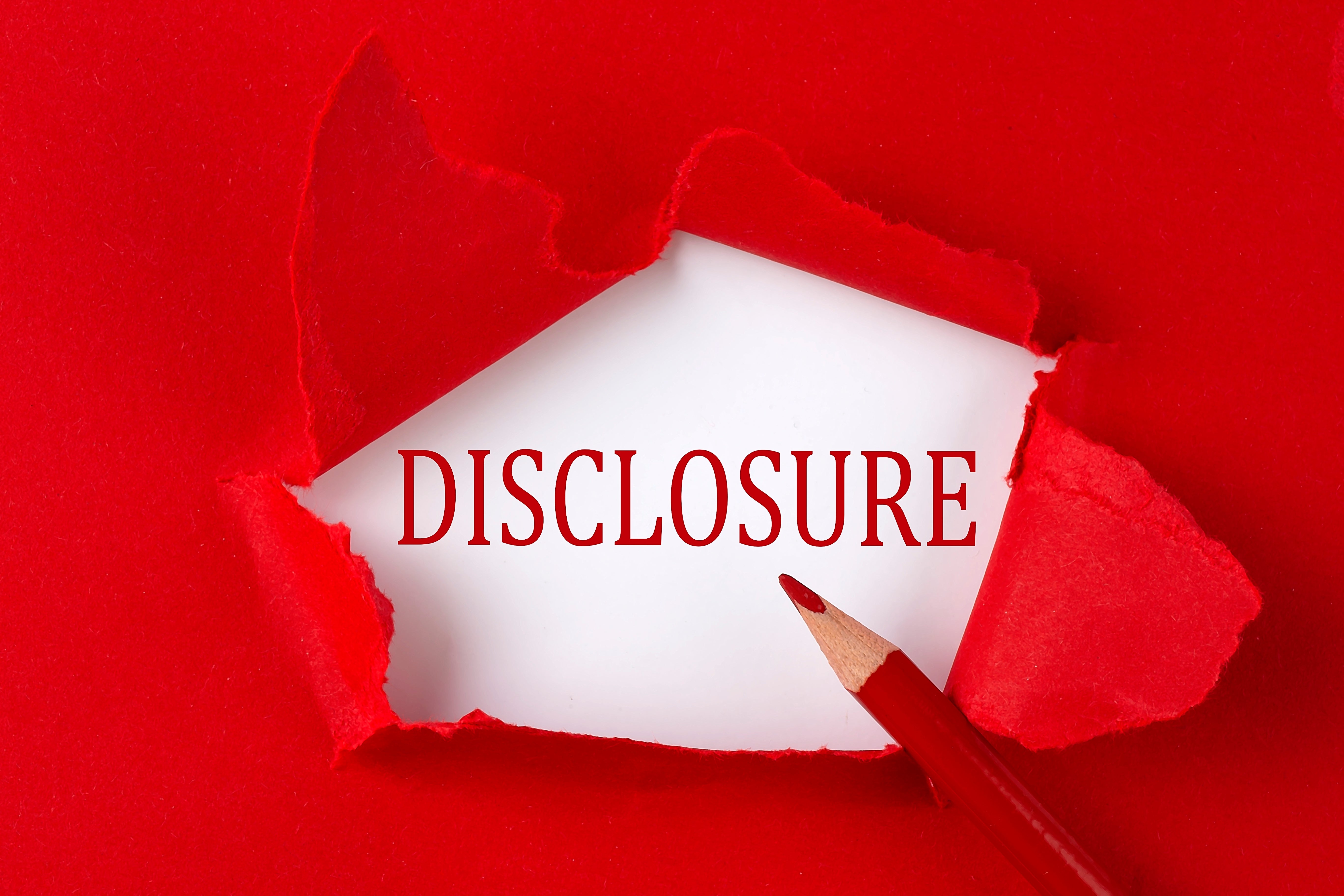 red paper and pencil tore open with the word, "disclosure" showing