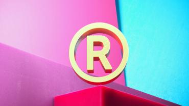 3D illustration of golden registered icon on magenta and cyan geometric background.