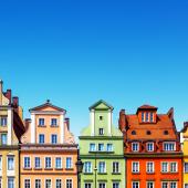 townhouses in Poland each painted as one color of the rainbow in descending order